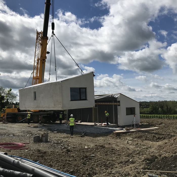 Modular homes,are transported to site on a lorry and craned into place